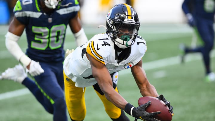 Dec 31, 2023; Seattle, Washington, USA; Pittsburgh Steelers wide receiver George Pickens (14) catches a pass against the Seattle Seahawks during the second half at Lumen Field. Mandatory Credit: Steven Bisig-USA TODAY Sports