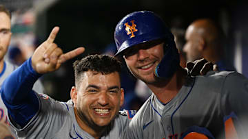 Jul 2, 2024; Washington, District of Columbia, USA; New York Mets second baseman Jose Iglesias (11) and first baseman Pete Alonso (20) pose for a photograph while celebrating in the dugout during the tenth inning against the Washington Nationals at Nationals Park. Mandatory Credit: Rafael Suanes-Imagn Images