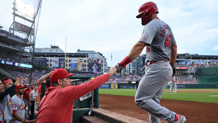 Jul 5, 2024; Washington, District of Columbia, USA; St. Louis Cardinals first baseman Paul Goldschmidt (46) gets a fist bump from hitting coach Turner Ward (49) after scoring a run against the Washington Nationals during the fourth inning at Nationals Park. Mandatory Credit: Rafael Suanes-USA TODAY Sports