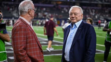 Sep 24, 2022; Arlington, Texas, USA; Dallas Cowboys owner Jerry Jones (right) and son Stephen Jones (left) wait to present the winner s trophy after the game between the Texas A&M Aggies and the Arkansas Razorbacks at AT&T Stadium. 