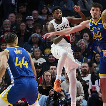 Oct 14, 2025; Portland, Oregon, USA; Portland Trail Blazers guard Blake Wesley (1) passes the ball during the first half against Golden State Warriors center Quinten Post (21) at Moda Center. Mandatory Credit: Troy Wayrynen-Imagn Images