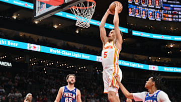 Dyson Daniels #5 of the Atlanta Hawks rises for a dunk against the Philadelphia 76ers.