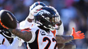 Oct 1, 2023; Chicago, Illinois, USA;  Denver Broncos safety Kareem Jackson (22) celebrates after intercepting a Chicago Bears pass in the fourth quarter at Soldier Field.  
