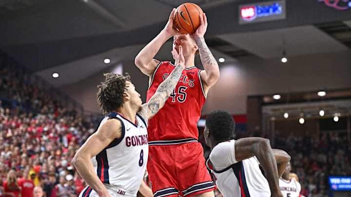 Jan 31, 2026; Spokane, Washington, USA; Saint Mary's Gaels center Andrew McKeever (45) shoots the ball against Gonzaga Bulldogs guard Jalen Warley (8) in the second half at McCarthey Athletic Center. Gonzaga Bulldogs won 73-65. Mandatory Credit: James Snook-Imagn Images