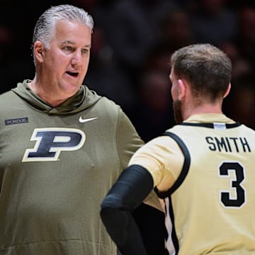 Purdue Boilermakers head coach Matt Painter talks with guard Braden Smith