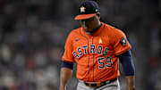 Sep 7, 2025; Arlington, Texas, USA; Houston Astros starting pitcher Framber Valdez (59) looks down as he walks off the field during the game between the Texas Rangers and the Houston Astros at Globe Life Field. Mandatory Credit: Jerome Miron-Imagn Images