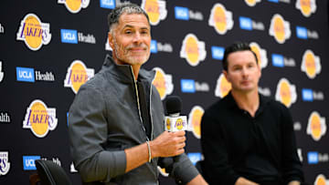 Sep 25, 2025; El Segundo, CA, USA; Los Angeles Lakers general manager Rob Pelinka, left, speaks during a press conference to preview the 2025-26 season at UCLA Health Training Center. Mandatory Credit: William Liang-Imagn Images