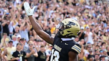 Aug 31, 2024; West Lafayette, Indiana, USA; Purdue Boilermakers wide receiver Jaron Tibbs (13) celebrates a touchdown during the second quarter against the Indiana State Sycamores at Ross-Ade Stadium. Mandatory Credit: Marc Lebryk-Imagn Images