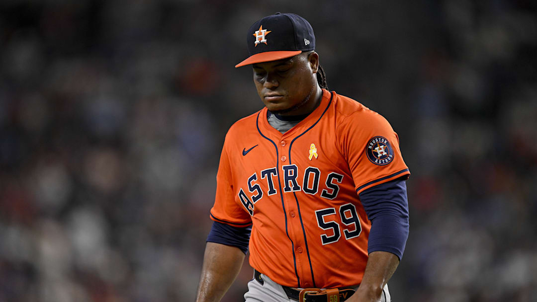 Sep 7, 2025; Arlington, Texas, USA; Houston Astros starting pitcher Framber Valdez (59) looks down as he walks off the field during the game between the Texas Rangers and the Houston Astros at Globe Life Field. Mandatory Credit: Jerome Miron-Imagn Images