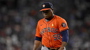 Sep 7, 2025; Arlington, Texas, USA; Houston Astros starting pitcher Framber Valdez (59) looks down as he walks off the field during the game between the Texas Rangers and the Houston Astros at Globe Life Field. Mandatory Credit: Jerome Miron-Imagn Images