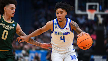 Mar 21, 2025; Seattle, WA, USA; Memphis Tigers guard PJ Haggerty (4) drives the ball during the second half against Colorado State Rams at Climate Pledge Arena. Mandatory Credit: Steven Bisig-Imagn Images
