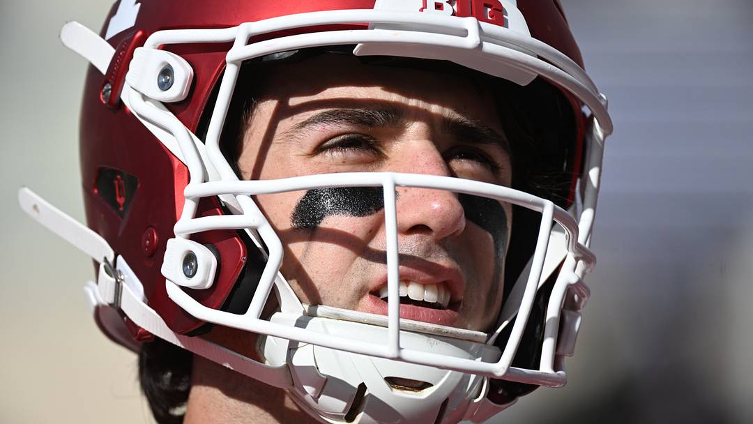 Josh Hoover warms up before the game against the Ohio State Buckeyes at Merchants Bank Field at Memorial Stadium.  