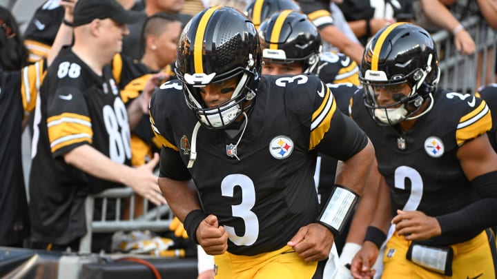 Aug 9, 2024; Pittsburgh, Pennsylvania, USA; Pittsburgh Steelers quarterback Russell Wilson (3) and Justin Fields (2) take the field for pre-game against the Houston Texans at Acrisure Stadium. 