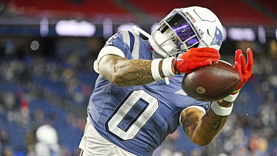Nov 13, 2025; Foxborough, Massachusetts, USA; New England Patriots cornerback Christian Gonzalez (0) warms up before the game against the New York Jets at Gillette Stadium. Mandatory Credit: Eric Canha-Imagn Images