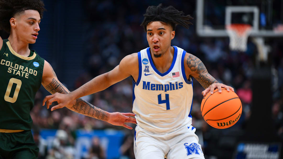 Mar 21, 2025; Seattle, WA, USA; Memphis Tigers guard PJ Haggerty (4) drives the ball during the second half against Colorado State Rams at Climate Pledge Arena. Mandatory Credit: Steven Bisig-Imagn Images