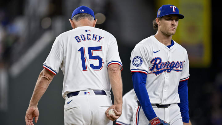 Jul 6, 2024; Arlington, Texas, USA; Texas Rangers manager Bruce Bochy (15) and relief pitcher Jacob Latz (67) during the game between the Texas Rangers and the Tampa Bay Rays at Globe Life Field. Mandatory Credit: Jerome Miron-USA TODAY Sports