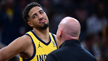 Oct 27, 2024; Indianapolis, Indiana, USA; Indiana Pacers guard Tyrese Haliburton (0) talks to a staff member during the second half against the Philadelphia 76ers at Gainbridge Fieldhouse. Mandatory Credit: Marc Lebryk-Imagn Images