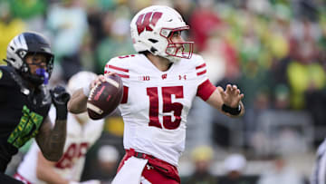 Oct 25, 2025; Eugene, Oregon, USA; Wisconsin Badgers quarterback Hunter Simmons (15) throws a pass during the first half against the Oregon Ducks at Autzen Stadium. Mandatory Credit: Troy Wayrynen-Imagn Images