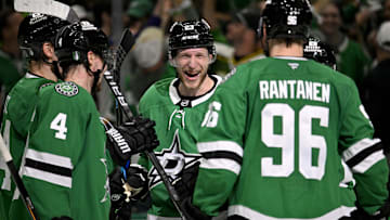 May 21, 2025; Dallas, Texas, USA; Dallas Stars defenseman Miro Heiskanen (4) and defenseman Esa Lindell (23) and right wing Mikko Rantanen (96) celebrate the empty net goal scored by Lindell against the Edmonton Oilers during the third period in game one of the Western Conference Final of the 2025 Stanley Cup Playoffs at American Airlines Center. Mandatory Credit: Jerome Miron-Imagn Images