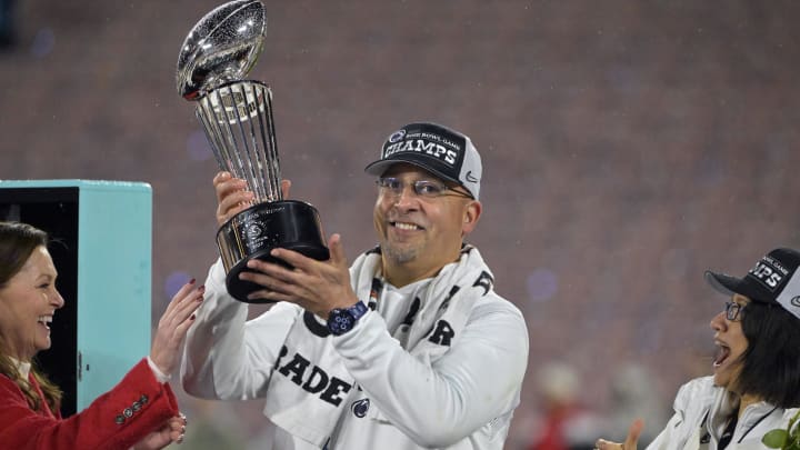 Penn State football coach James Franklin celebrates with the Rose Bowl trophy after the Nittany Lions defeated Utah in the 109th Rose Bowl game. 