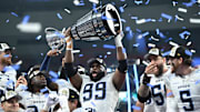 Nov 17, 2024; Vancouver, British Columbia, CAN;  Toronto Argonauts defensive lineman Ralph Holley (99) holds the Grey Cup after the win Winnipeg Blue Bombers at BC Place. Mandatory Credit: Anne-Marie Sorvin-Imagn Images