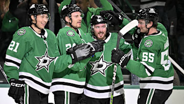 Mar 6, 2025; Dallas, Texas, USA; Dallas Stars left wing Jason Robertson (21) and center Matt Duchene (95) and center Roope Hintz (24) and defenseman Thomas Harley (55) celebrates after Robertson scores the game winning goal the Calgary Flames during the overtime period at the American Airlines Center. Mandatory Credit: Jerome Miron-Imagn Images
