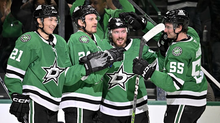 Mar 6, 2025; Dallas, Texas, USA; Dallas Stars left wing Jason Robertson (21) and center Matt Duchene (95) and center Roope Hintz (24) and defenseman Thomas Harley (55) celebrates after Robertson scores the game winning goal the Calgary Flames during the overtime period at the American Airlines Center. Mandatory Credit: Jerome Miron-Imagn Images