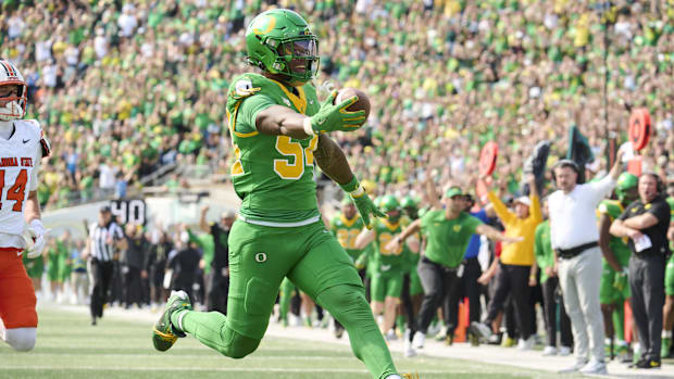 jerry mixon oregon ducks dan lanning oklahoma state cowboys linebacker tosh lupoi brian michalowski peyton woodyard defense