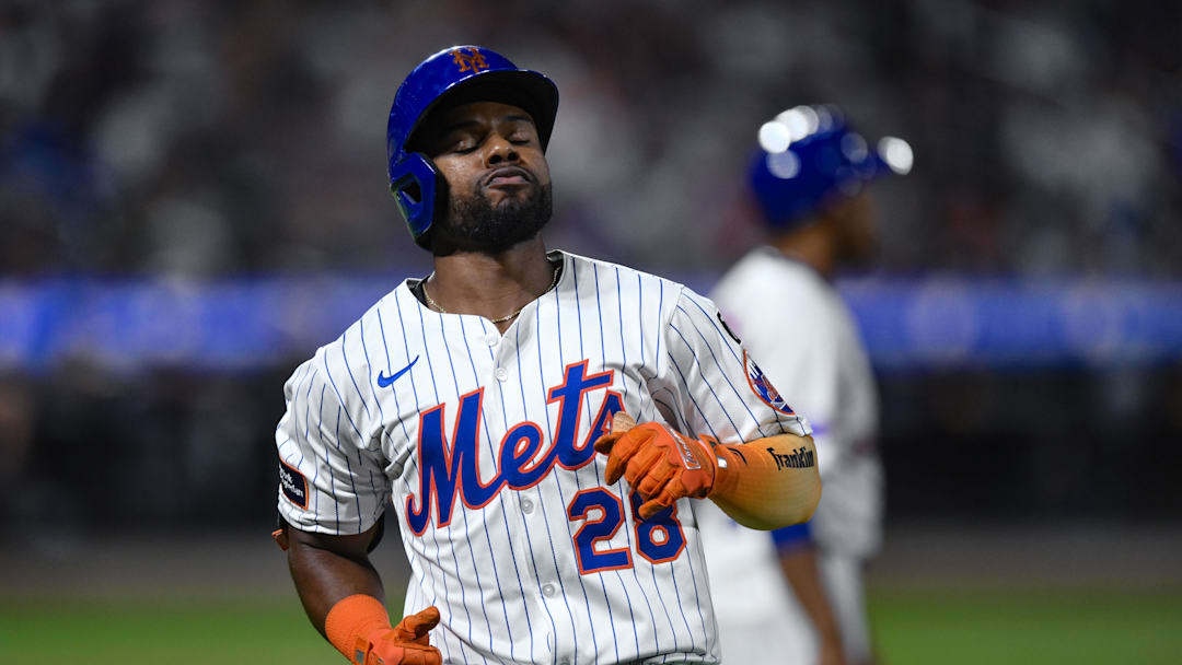Aug 28, 2025; New York City, New York, USA; New York Mets outfielder Cedric Mullins (28) reacts after hitting a line drive for an out against the Miami Marlins during the sixth inning  at Citi Field. Mandatory Credit: John Jones-Imagn Images