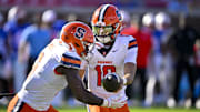 Oct 4, 2025; Dallas, Texas, USA; Syracuse Orange quarterback Rickie Collins (10) hands off the ball to running back Yasin Willis (6) during the second half against the SMU Mustangs at Gerald J. Ford Stadium. 