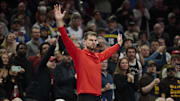 Oct 31, 2025; Portland, Oregon, USA; Portland Trail Blazers assistant coach Tiago Splitter raises reacts in the closing second of a game against the Denver Nuggets at Moda Center. Mandatory Credit: Troy Wayrynen-Imagn Images