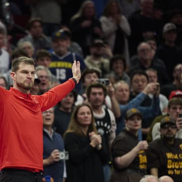 Oct 31, 2025; Portland, Oregon, USA; Portland Trail Blazers assistant coach Tiago Splitter raises reacts in the closing second of a game against the Denver Nuggets at Moda Center. Mandatory Credit: Troy Wayrynen-Imagn Images