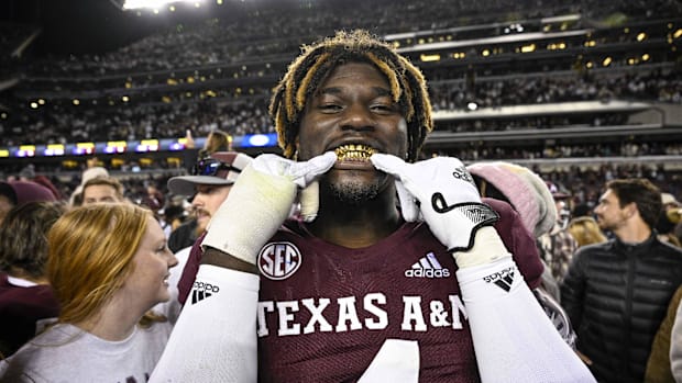 Texas A&M Aggies defensive lineman Shemar Stewart shows off his gold grill smile after the Aggies defeat the LSU Tigers. 