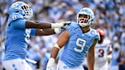 Sep 13, 2025; Chapel Hill, North Carolina, USA; North Carolina Tar Heels defensive lineman Melkart Abou-Jaoude (9 ) celebrates with defensive lineman Smith Vilbert (8) after making a sack in the first quarter at Kenan Stadium. Mandatory Credit: Bob Donnan-Imagn Images