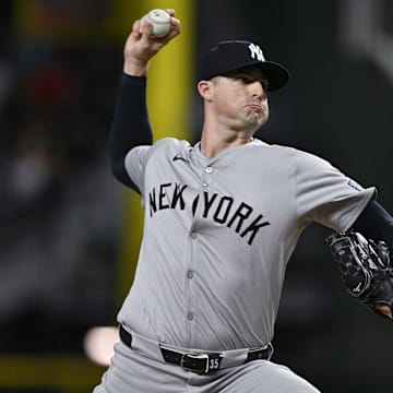 Sep 2, 2024; Arlington, Texas, USA; New York Yankees relief pitcher Clay Holmes (35) pitches against the Texas Rangers during the ninth inning at Globe Life Field. Mandatory Credit: Jerome Miron-Imagn Images