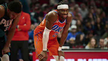 Nov 30, 2025; Portland, Oregon, USA; Oklahoma City Thunder guard Shai Gilgeous-Alexander (2) smiles at a fan during the second half in a game against the Portland Trail Blazers at Moda Center. Mandatory Credit: Troy Wayrynen-Imagn Images