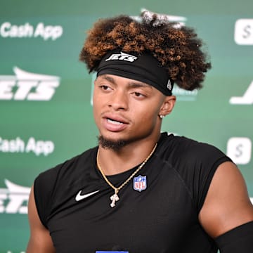 Jun 11, 2025; Florham Park, NY, USA; New York Jets quarterback Justin Fields (7) speaks at a press conference during minicamp at Atlantic Health Jets Training Center. Mandatory Credit: John Jones-Imagn Images