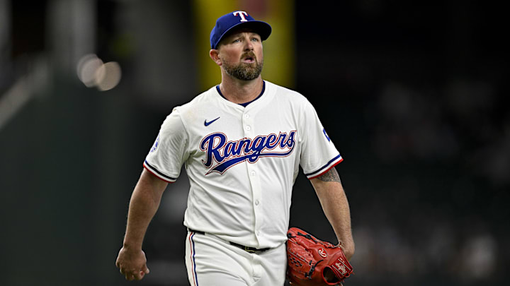 Aug 21, 2024; Arlington, Texas, USA; Texas Rangers relief pitcher Kirby Yates (39) walks off the field after he pitches against the Pittsburgh Pirates during the ninth inning at Globe Life Field. Mandatory Credit: Jerome Miron-Imagn Images