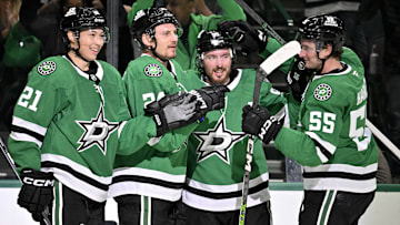 Mar 6, 2025; Dallas, Texas, USA; Dallas Stars left wing Jason Robertson (21) and center Matt Duchene (95) and center Roope Hintz (24) and defenseman Thomas Harley (55) celebrates after Robertson scores the game winning goal the Calgary Flames during the overtime period at the American Airlines Center. Mandatory Credit: Jerome Miron-Imagn Images