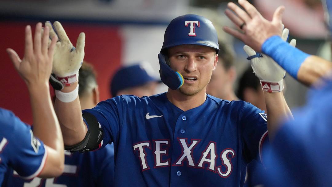 Texas Rangers shortstop Corey Seager (5) is congratulated by teammates after hitting a home run. Texas Rangers shortstop Corey Seager (5) is congratulated by teammates after hitting a home run.