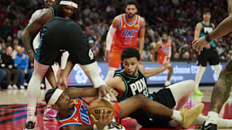 Nov 30, 2025; Portland, Oregon, USA; Oklahoma City Thunder guard Shai Gilgeous-Alexander (2) scrambles to control the ball during the second half against Portland Trail Blazers guard Shaedon Sharpe (17) and forward Toumani Camara (33) at Moda Center. Mandatory Credit: Troy Wayrynen-Imagn Images