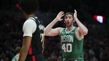 Mar 23, 2025; Portland, Oregon, USA; Boston Celtics center Luke Kornet (40) reacts during the second half against to being called for a foule during the second half against the Portland Trail Blazers at Moda Center. Mandatory Credit: Troy Wayrynen-Imagn Images