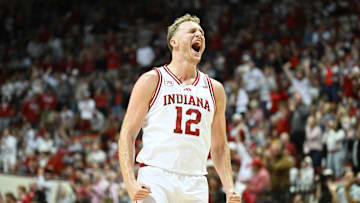 Nov 5, 2025; Bloomington, Indiana, USA; Indiana Hoosiers forward Tucker Devries (12) celebrates after a play during the second half against the Alabama A&M Bulldogs at Simon Skjodt Assembly Hall. Mandatory Credit: Robert Goddin-Imagn Images