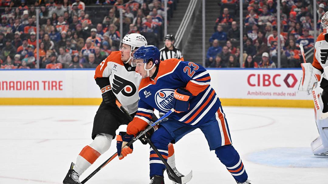Jan 3, 2026; Edmonton, Alberta, CAN; Edmonton Oilers right winger Quinn Hutson (23) and Philadelphia Flyers defenseman Nick Seeler (24) are seen out on the ice during the first period at Rogers Place. Mandatory Credit: Walter Tychnowicz-Imagn Images