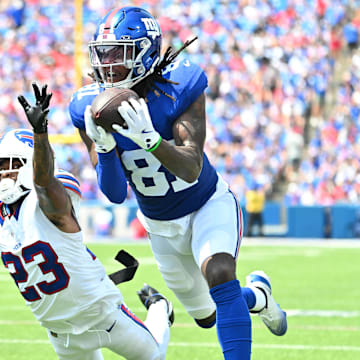 Aug 9, 2025; Orchard Park, New York, USA; New York Giants wide receiver Lil'Jordan Humphrey (81) catches a pass for a touchdown as Buffalo Bills cornerback Dane Jackson (23) defends