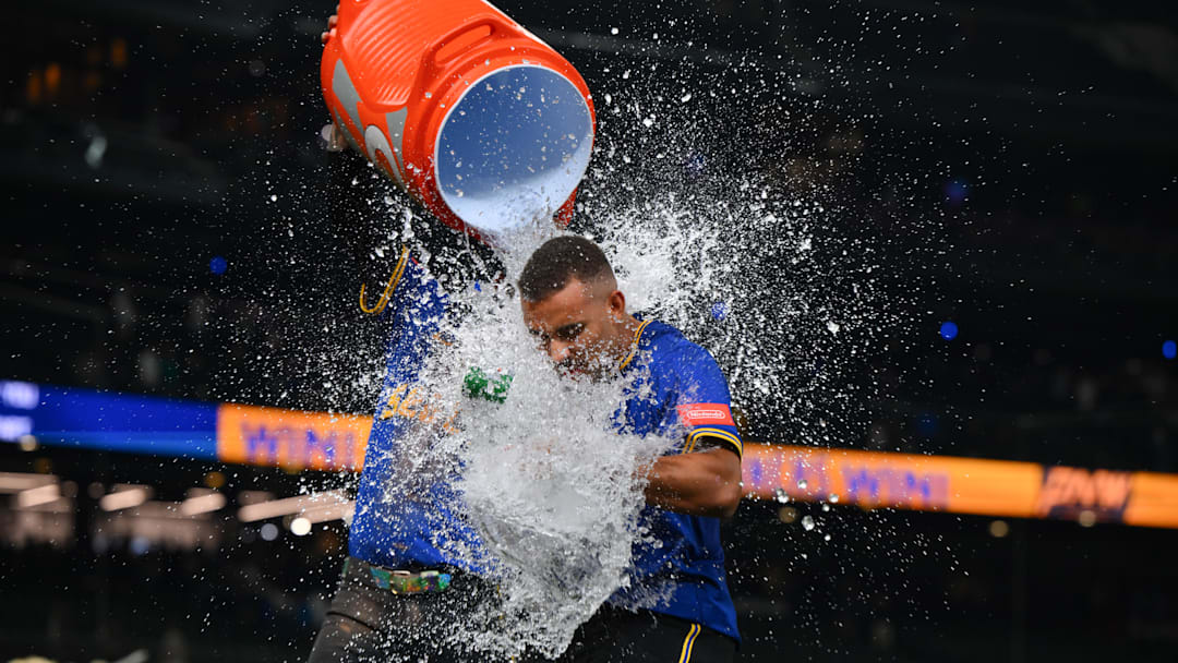 Sep 11, 2025; Seattle, Washington, USA; Seattle Mariners shortstop J.P. Crawford (3) dunks the water jug on pinch hitter Harry Ford (5) after the Mariners defeated the Los Angeles Angels at T-Mobile Park. Mandatory Credit: Steven Bisig-Imagn Images