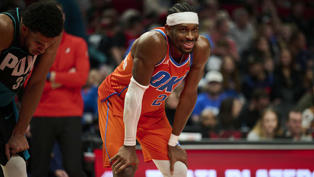 Nov 30, 2025; Portland, Oregon, USA; Oklahoma City Thunder guard Shai Gilgeous-Alexander (2) smiles at a fan during the second half in a game against the Portland Trail Blazers at Moda Center. Mandatory Credit: Troy Wayrynen-Imagn Images