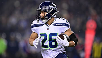 Dec 26, 2024; Chicago, Illinois, USA; Seattle Seahawks running back Zach Charbonnet (26) runs the ball against the Chicago Bears during the first quarter at Soldier Field. Mandatory Credit: Daniel Bartel-Imagn Images