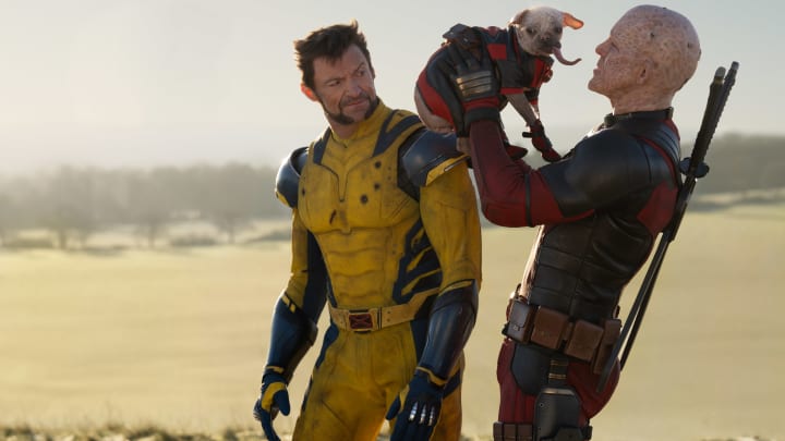 (L-R): Hugh Jackman as Wolverine/Logan, Dogpool, and Ryan Reynolds as Deadpool/Wade Wilson in 20th Century Studios/Marvel Studios' DEADPOOL & WOLVERINE. Photo by Jay Maidment. © 2024 20th Century Studios / © and ™ 2024 MARVEL.