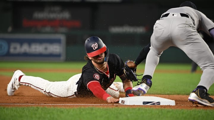 Aug 27, 2024; Washington, District of Columbia, USA; Washington Nationals center fielder Dylan Crews (3) dives into third base in front of New York Yankees third baseman Jazz Chisholm Jr. (13) during the sixth inning at Nationals Park. 